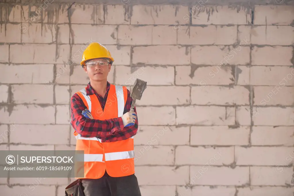 Construction mason worker bricklayer on new site
