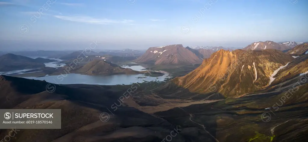 Mountainous terrain with lake in morning