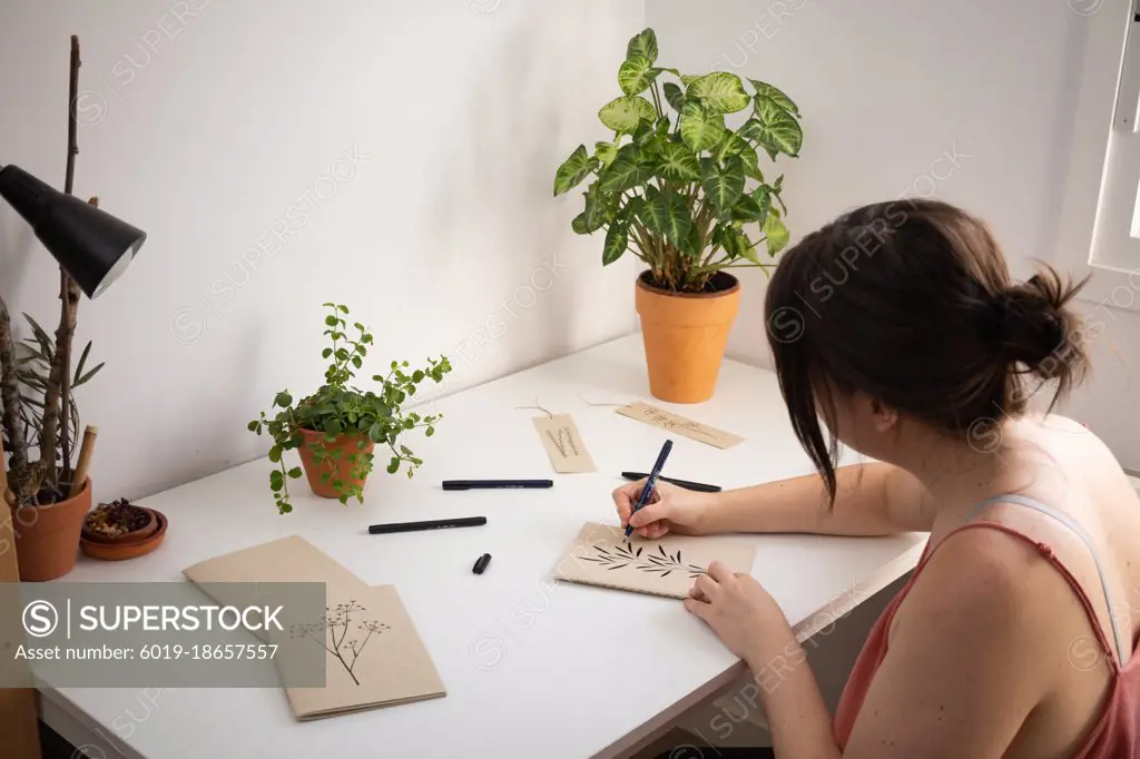 woman drawing in her room