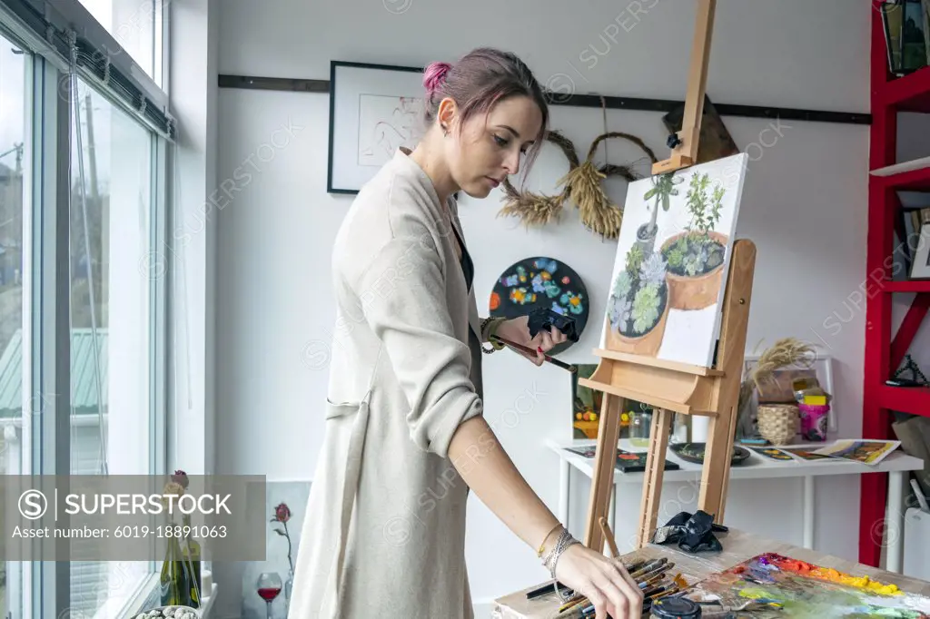 Woman artist oil painting on canvas