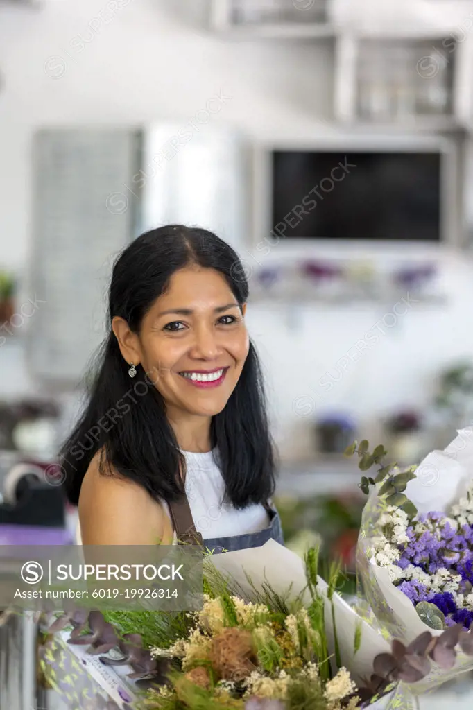 happy woman in her flower shop