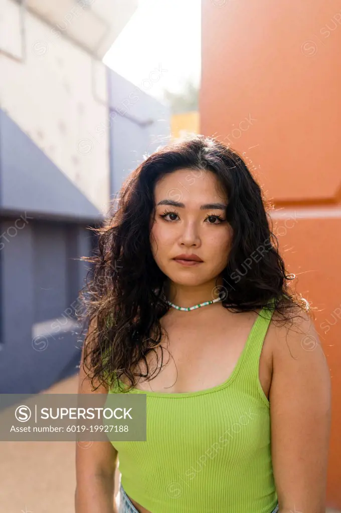 Colorful portrait of a beautiful Asian woman looking at camera