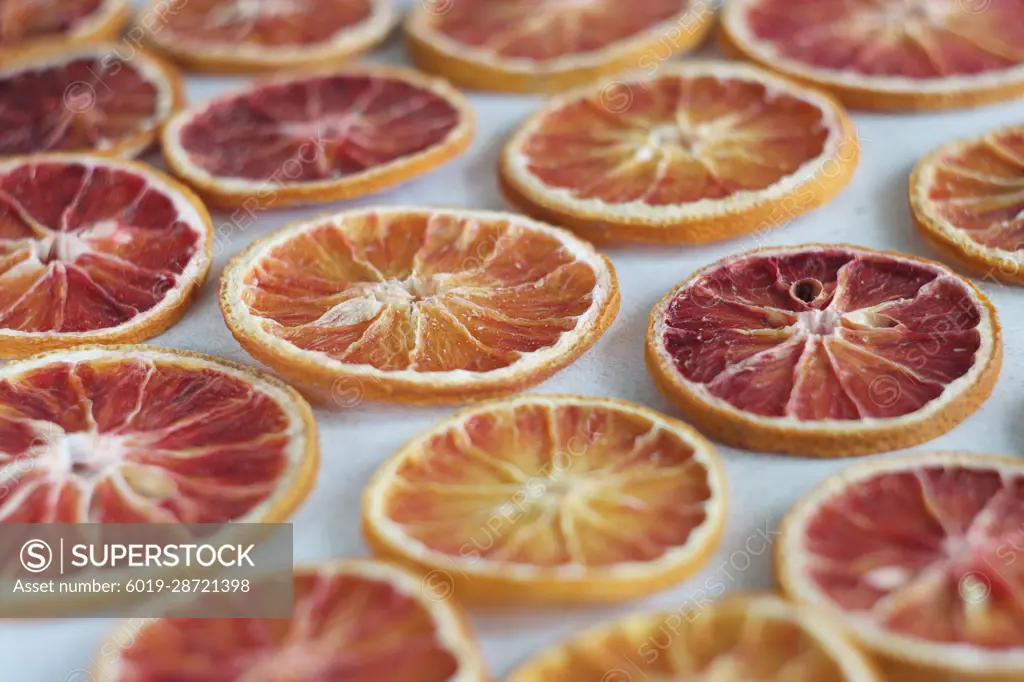 Dried orange slices lie on a table.