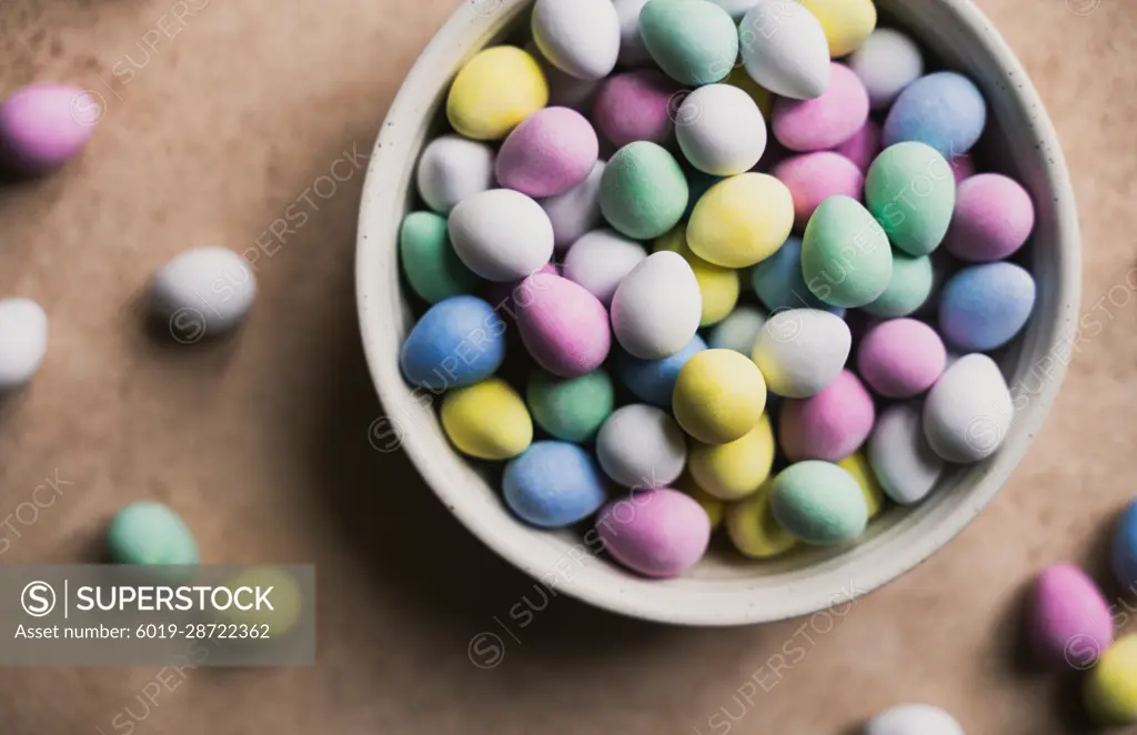 Close up of bowl of colorful mini chocolate eggs for Easter.