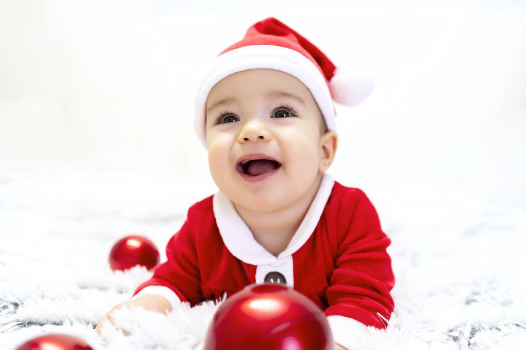 beautiful baby dressed as santa claus