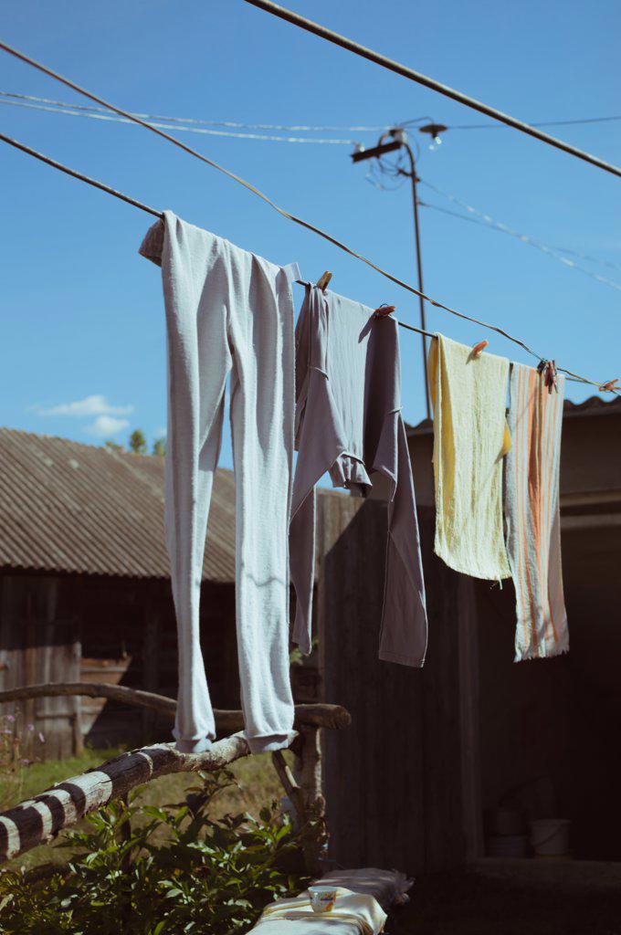 Clothes drying on clothesline on sunny day