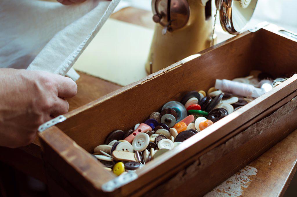 Vintage wooden box with colorful retro buttons