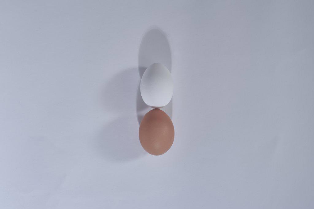 Two eggs grey plain minimal background, top view, happy Easter day