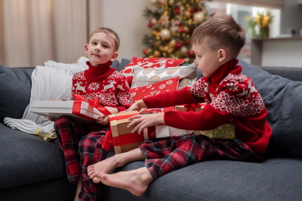 children looking at christmas presents