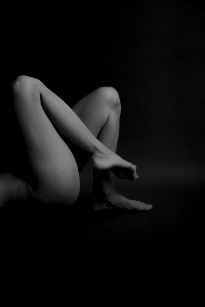 Black and white photo of body parts. Geometry and yoga poses