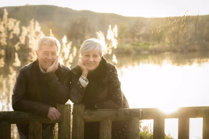 older couple models in love in the sunset