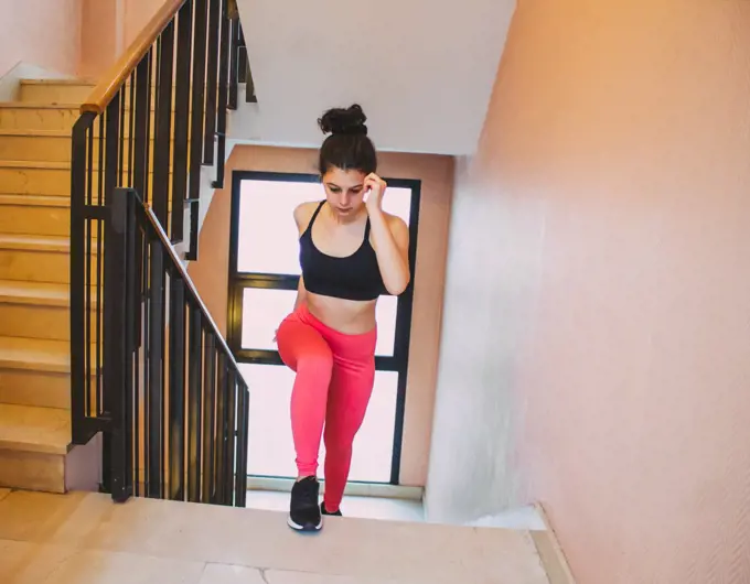 woman exercising going up stairs