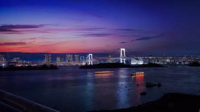 rainbow bridge of odaiba tokyo japan with cityscape in sunset sk
