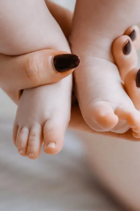 Newborn feets closeup, natural colours