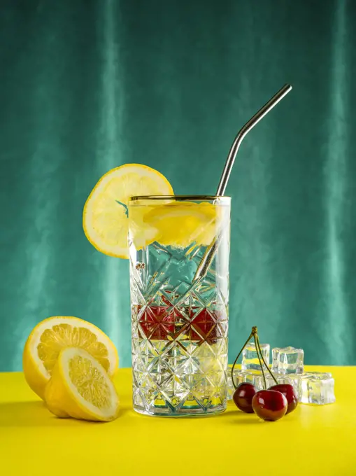 A glass of Lemonade with straw