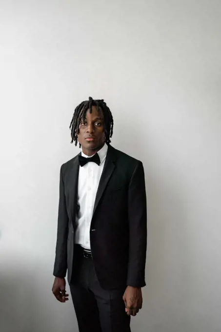 Portrait of the black man with dreadlocks wearing a suit