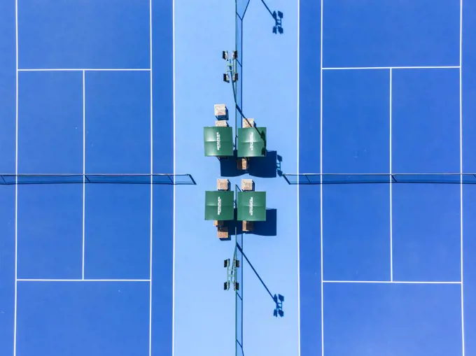 Beautiful top down view to blue hard tennis court with white lines