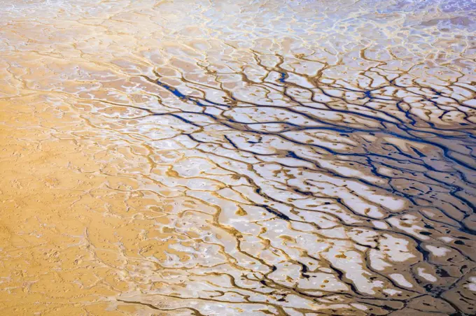 Aerial abstract view of Kati Thanda, Lake Eyre arid desert showing drought and blue water 
