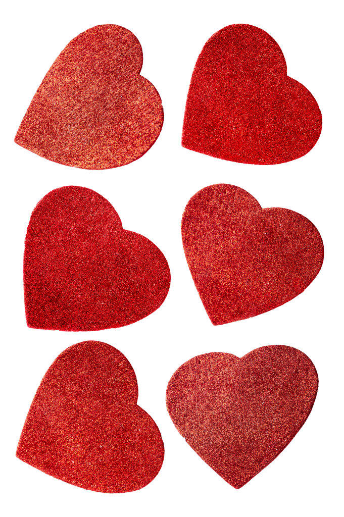 Set of red sparkling hearts isolated on the white, design element