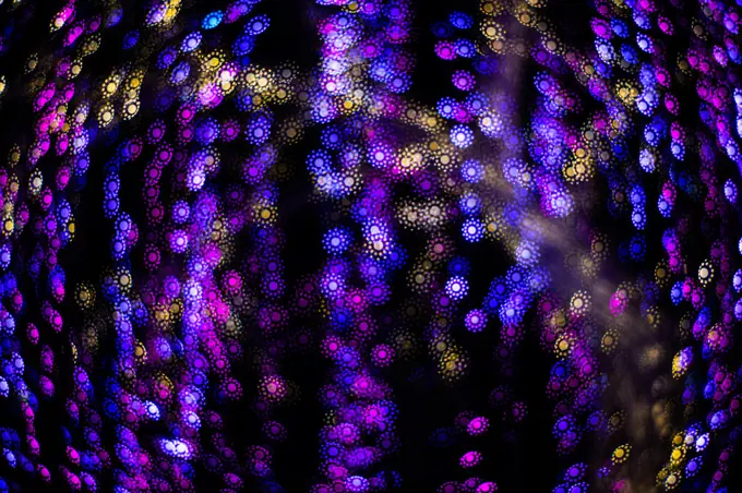 Abstract blurry, low depth of field bokeh light shapes. Vivid, colourful light effects background picture with different shapes and dots in various colours. Perfect for Christmas backgrounds