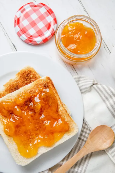 Breakfast of toast with peach jam