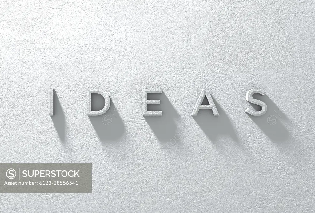 A 3d rendered sign of the word IDEAS on a dramatically lit whte textured wall.