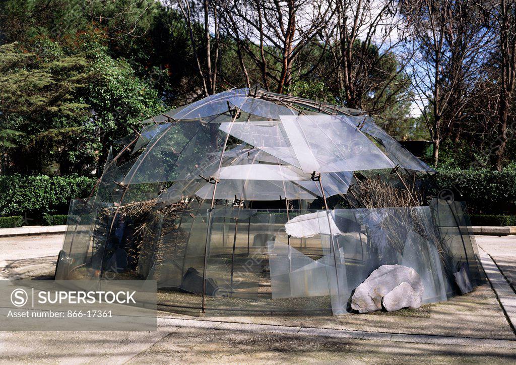 Stock Photo: 866-17361 Igloo of the Palacio de las Alhajas; Igloo del Palacio de las Alhajas. Mario Merz (1925-2003). 2 semicircular structures, C-clamps, Felt, Slate, Broken glass, bread, tree branches and a stone. Executed 1982. 250 x 500cm