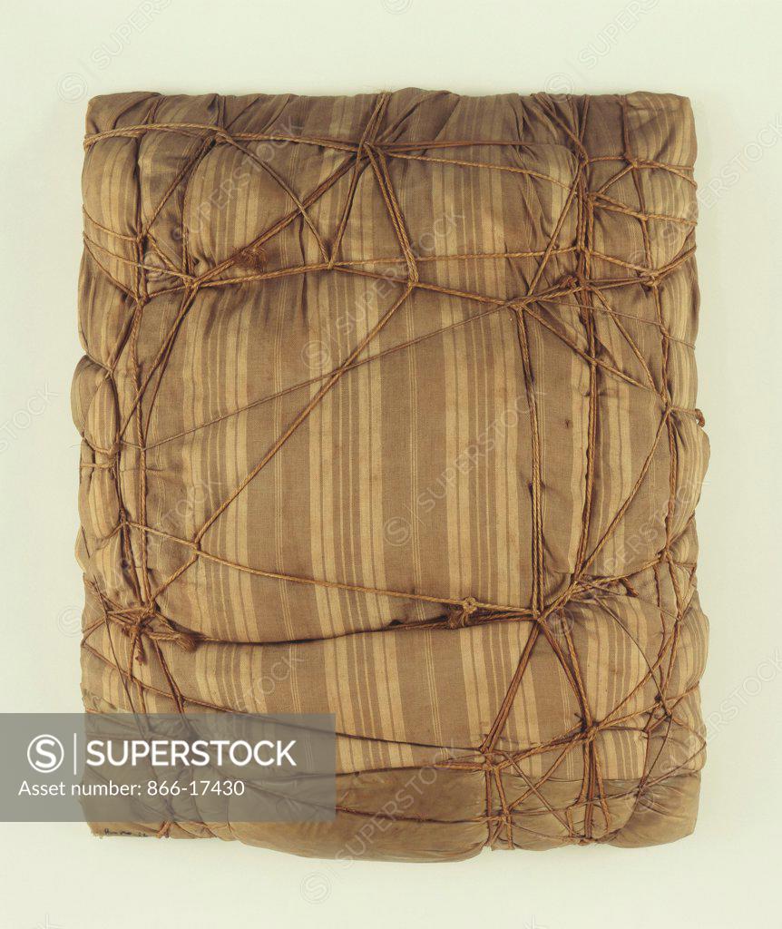 Stock Photo: 866-17430 Package 1962. Christo (b.1935). Mattress, plastic and rope. 75 x 61cm.