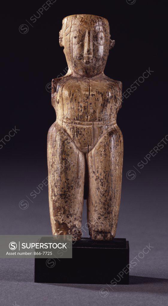 Stock Photo: 866-7725 A Fatamid ivory male figurine with stocky body, lightly delineated loincloth and large head carved with almond shaped eyes. Circa 11th century, 11.1cm high.