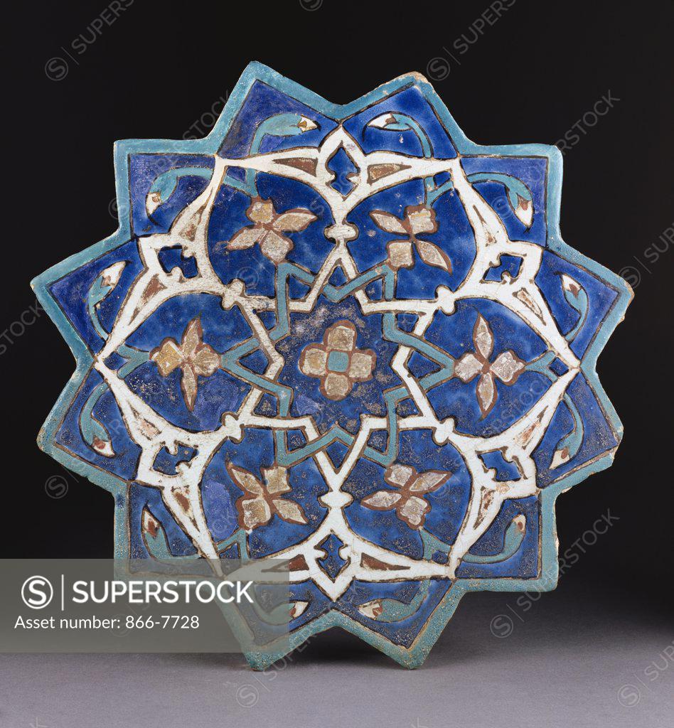 Stock Photo: 866-7728 A Samarkand Cuerda Seca stellar tile of twelve pointed form, the blue ground with a central turquoise and gold flower outlined in red. Circa 1450, 34.4cm across. Catalogue no. 2027c.