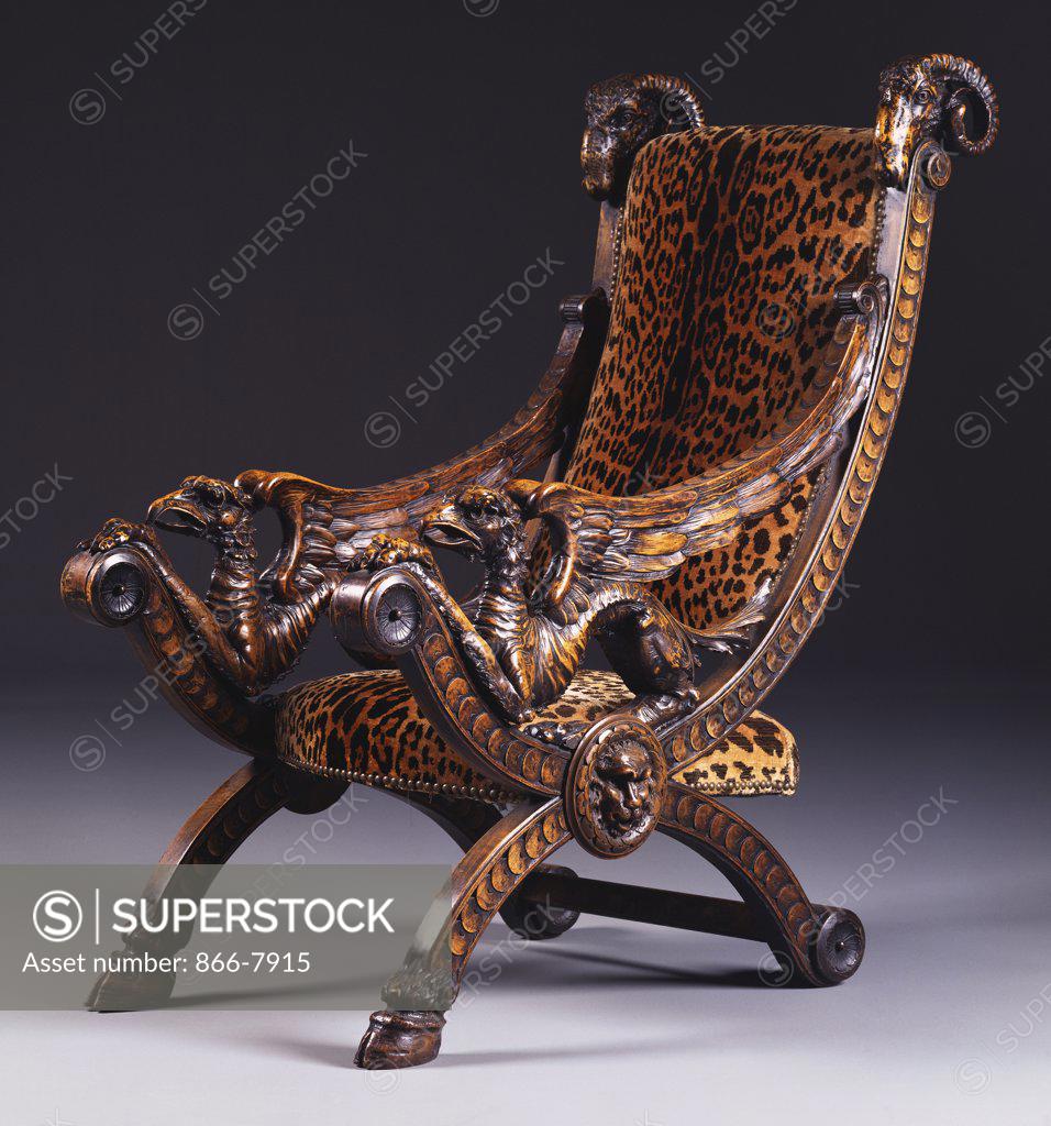 Stock Photo: 866-7915 A German walnut armchair, the rectangular padded back and bowed seat covered in simulated leopard-skin.