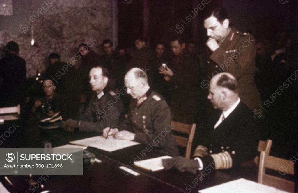 Stock Photo: 900-101898 German General Alfred Jodl signs unconditional surrender terms at Reims, France, May 7, 1945