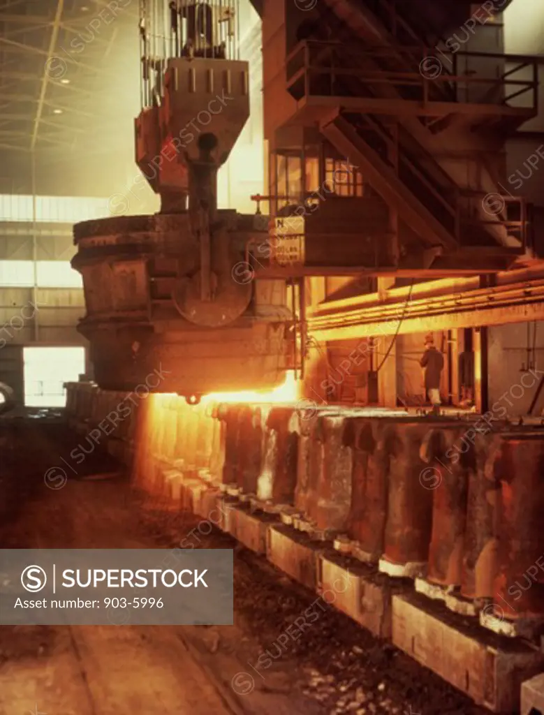 Foundry worker working on a blast furnace in a steel mill, US Steel, Gary, Indiana, USA
