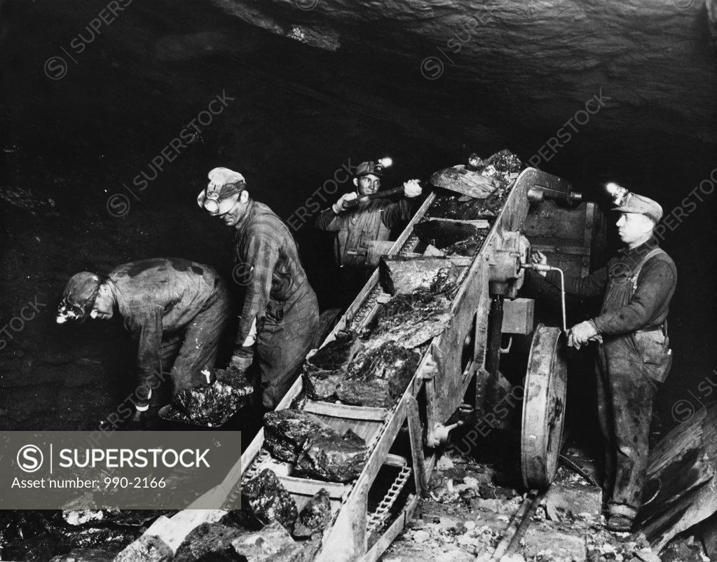 Stock Photo: 990-2166 High angle view of four miners working in a pit mine, Pennsylvania, USA