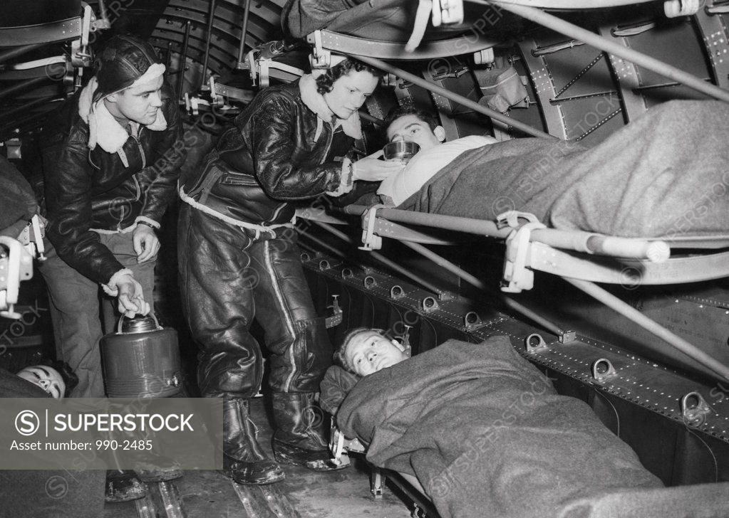 Stock Photo: 990-2485 Female nurses examining victims, Great Britain, 1943