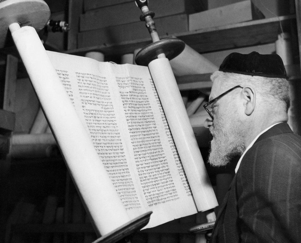 Torah scribe reading the torah